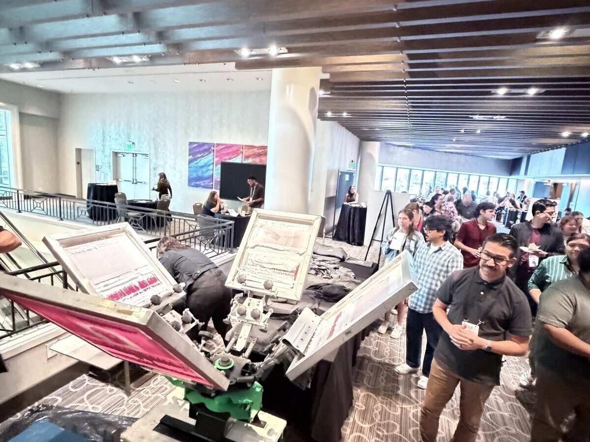 Line of wedding guests waiting at the live printing station