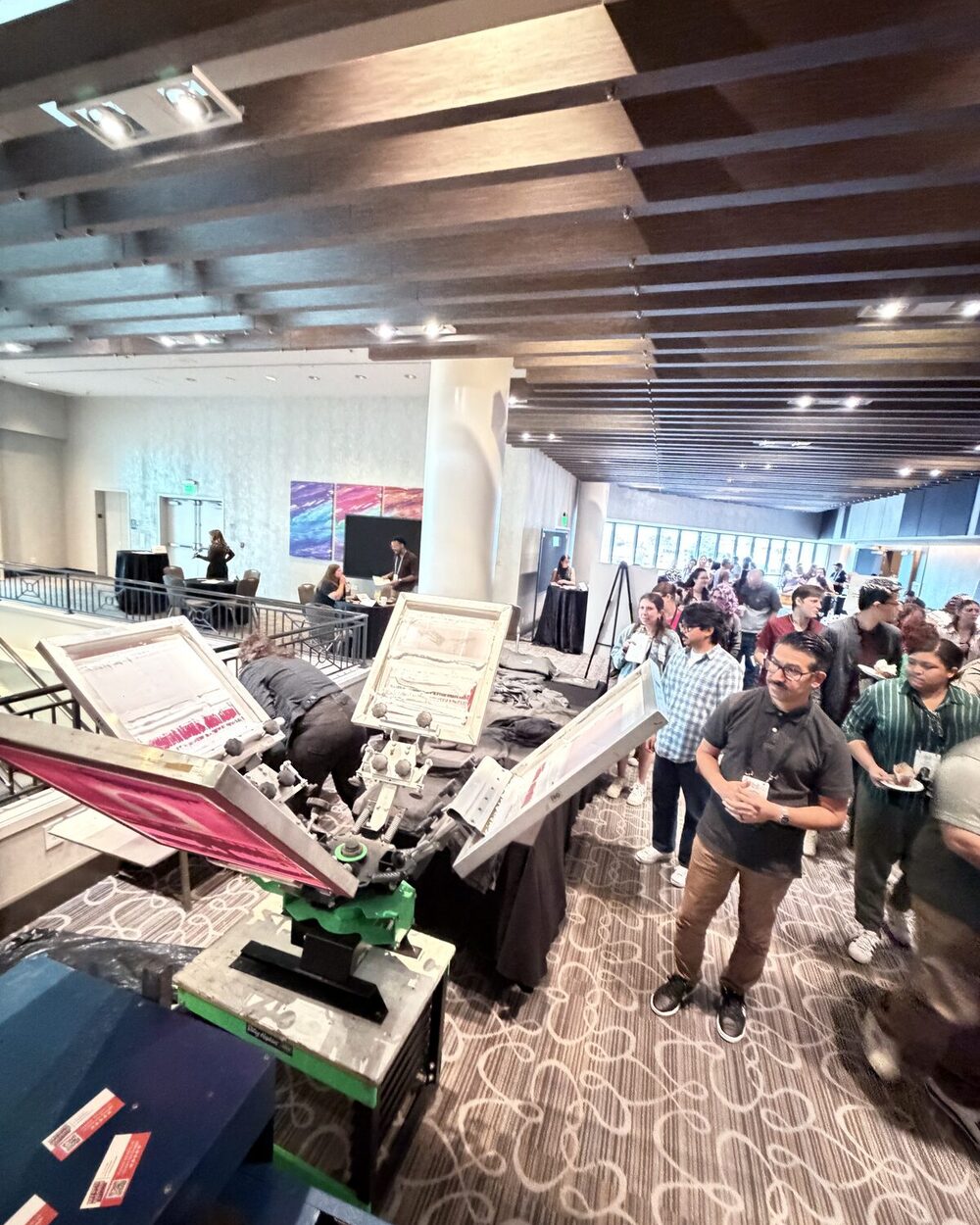 Wedding guests at a live printing station